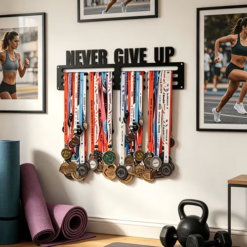 Never Give Up medal hanger mounted on wall with running photos, yoga mats and kettlebell